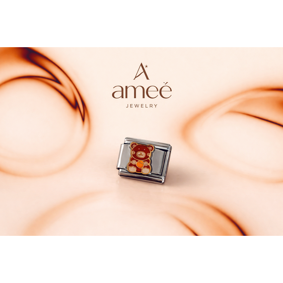 Charm plateado con oso color marron al relieve